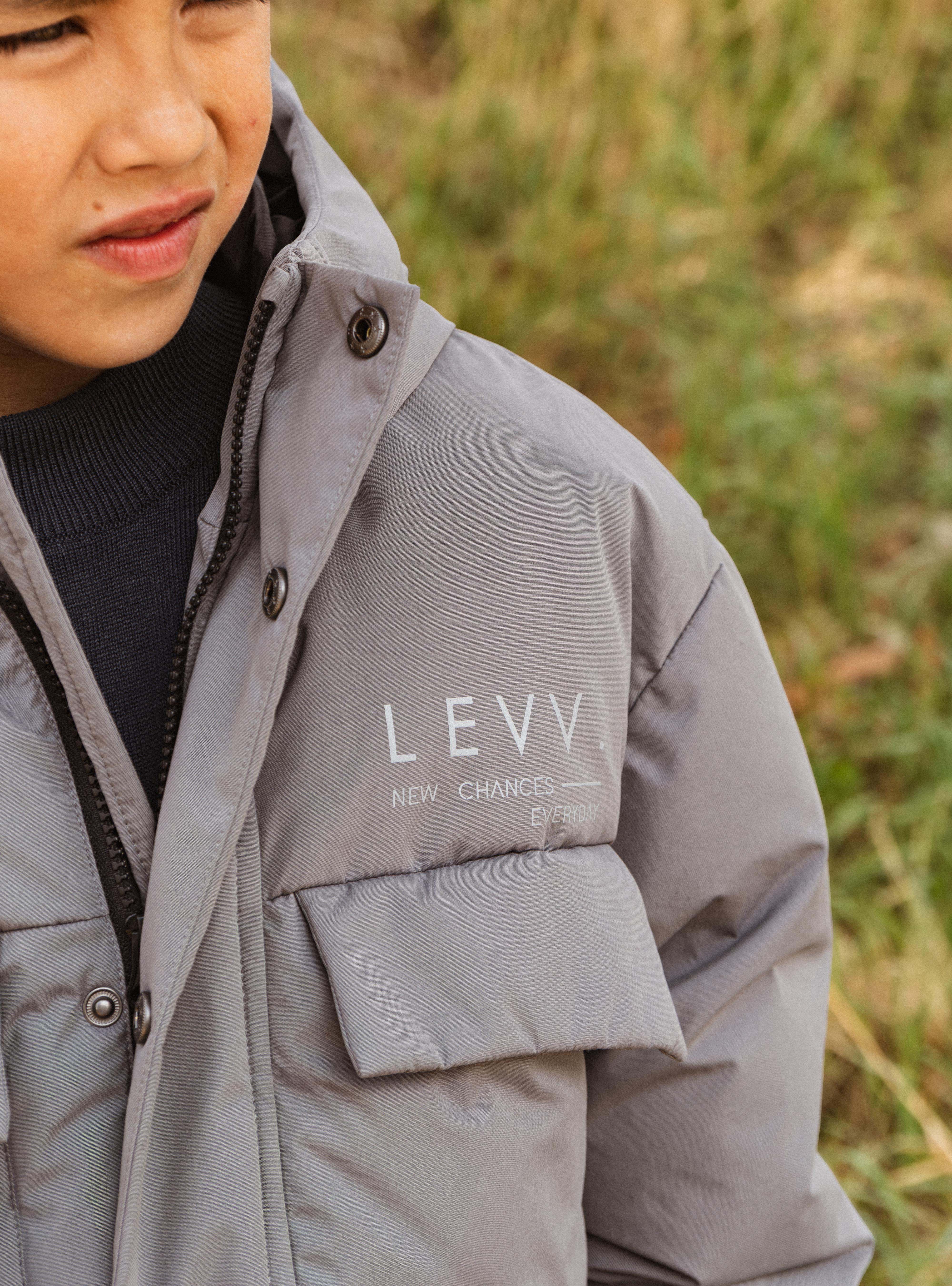 Grijze jas met capuchon en klepzakken | Soft Grey